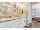 Spa-like bathroom with double vanity and a view into the bedroom at 335 Alto Avec Ln, Henderson, NV 89011