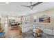 Open living space with light-colored sectional sofa and kitchen views at 335 Alto Avec Ln, Henderson, NV 89011