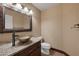 Elegant bathroom with granite vanity and decorative mirror at 3362 Classic Bay Ln, Las Vegas, NV 89117