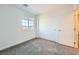 Bright bedroom with grey carpet, large closet, and window with mountain view at 340 Silva Pl, Henderson, NV 89011