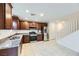 Modern kitchen with dark wood cabinets and stainless steel appliances at 340 Silva Pl, Henderson, NV 89011