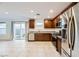 Modern kitchen with dark wood cabinets and stainless steel appliances at 340 Silva Pl, Henderson, NV 89011