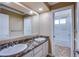 Bathroom with double vanity, marble countertop, and bathtub at 3699 Mountcrest Dr, Las Vegas, NV 89121