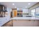 Modern kitchen featuring stainless steel appliances and white cabinetry at 3699 Mountcrest Dr, Las Vegas, NV 89121