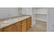 Double vanity bathroom with granite countertop and large closet at 38 E Serene Ave # 416, Las Vegas, NV 89123