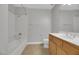 Single vanity bathroom with tub and neutral tile at 38 E Serene Ave # 416, Las Vegas, NV 89123