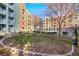 Community features a grassy courtyard, pool, and modern building at 38 E Serene Ave # 416, Las Vegas, NV 89123