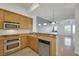 Open concept kitchen with island and stainless steel appliances at 38 E Serene Ave # 416, Las Vegas, NV 89123