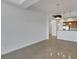 Bright living room with kitchen and tile floors at 38 E Serene Ave # 416, Las Vegas, NV 89123