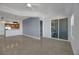 Open living area with access to patio and kitchen at 38 E Serene Ave # 416, Las Vegas, NV 89123