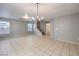 Dining room with tile floors and staircase access at 4217 Perfect Drift St, Las Vegas, NV 89129