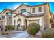 Two-story house with tan exterior, brown roof, and landscaping at 4217 Perfect Drift St, Las Vegas, NV 89129