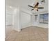 Living room with ceiling fan, tile floors and door access at 4356 Hera Temple Ave, North Las Vegas, NV 89031