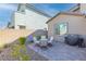 Cozy backyard patio with seating area and built-in grill at 4368 Latitude Valley Ct, North Las Vegas, NV 89084