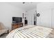 Bright bedroom with a comfortable bed and a rustic wooden accent piece at 4368 Latitude Valley Ct, North Las Vegas, NV 89084