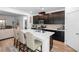 Modern kitchen with an island and dark cabinetry at 4368 Latitude Valley Ct, North Las Vegas, NV 89084