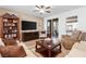 Comfortable living room with plenty of seating and built-in shelving at 4368 Latitude Valley Ct, North Las Vegas, NV 89084