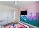 Bright bedroom with fun wall art and comfortable bedding at 5505 Desert Mirage St, North Las Vegas, NV 89081