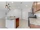 Kitchen island with granite countertop and modern fixtures at 5612 Hill Cliff Ct, North Las Vegas, NV 89031