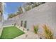 Landscaped backyard featuring artificial turf and gravel at 639 Morbucks Ln # 1044, Henderson, NV 89011