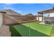 Putting green and covered patio in backyard at 6823 Camino Real St, North Las Vegas, NV 89086