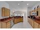 Kitchen with granite countertops and wood cabinets at 7096 Wild Wave Dr, Las Vegas, NV 89131