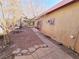 Landscaped backyard with stone pathway and mature trees at 71 E Atlantic Ave, Henderson, NV 89015