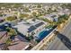 Aerial view showcasing this home's backyard oasis with a pool, spa, and solar panels for energy efficiency at 8075 Palm Cove Ct, Las Vegas, NV 89129