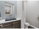 Modern powder room featuring a vessel sink, decorative tile accent wall, and sleek fixtures at 8075 Palm Cove Ct, Las Vegas, NV 89129
