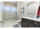 Bathroom with a stand up shower, single sink vanity, and tile flooring at 8075 Palm Cove Ct, Las Vegas, NV 89129