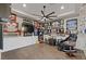 Entertaining room with sports memorabilia, sleek wood floors, and comfortable seating at 8075 Palm Cove Ct, Las Vegas, NV 89129