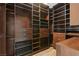 Spacious walk-in closet with custom shelving, drawers, and racks for optimal organization at 8075 Palm Cove Ct, Las Vegas, NV 89129