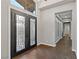 Elegant entryway with herringbone floors and double doors at 8075 Palm Cove Ct, Las Vegas, NV 89129