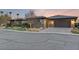 Modern home with attached garage and desert landscaping at 8075 Palm Cove Ct, Las Vegas, NV 89129