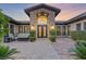 Grand entrance with double doors and a courtyard at 8075 Palm Cove Ct, Las Vegas, NV 89129