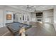 Game room features a pool table, fireplace, and built-in shelving at 8075 Palm Cove Ct, Las Vegas, NV 89129