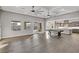Spacious great room with hardwood floors and ceiling fan at 8075 Palm Cove Ct, Las Vegas, NV 89129