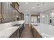 Modern kitchen with stainless steel appliances and a large island at 8075 Palm Cove Ct, Las Vegas, NV 89129