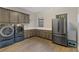 Laundry room with washer, dryer, and cabinets at 8075 Palm Cove Ct, Las Vegas, NV 89129