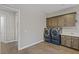 Bright laundry room with modern washer and dryer at 8075 Palm Cove Ct, Las Vegas, NV 89129