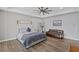 Spacious main bedroom with hardwood floors and a sitting area at 8075 Palm Cove Ct, Las Vegas, NV 89129