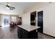 Kitchen with island, dark cabinets, and hardwood floors at 9613 Sterling Ridge Ave, Las Vegas, NV 89129