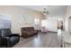 Living Room with vaulted ceilings, wood-look floors, and comfortable seating at 9613 Sterling Ridge Ave, Las Vegas, NV 89129