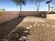 Landscaped backyard with gravel and a paved patio area at 9801 Fast Elk St, Las Vegas, NV 89143