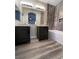 Bathroom with double vanity, bathtub, and wood-look floor at 9801 Fast Elk St, Las Vegas, NV 89143