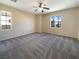 Spacious bedroom featuring ceiling fan and plush carpeting at 9801 Fast Elk St, Las Vegas, NV 89143