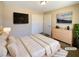Spacious bedroom with large bed, dresser, and mounted TV at 9801 Fast Elk St, Las Vegas, NV 89143