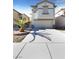 Two-story house with attached garage and palm tree at 9801 Fast Elk St, Las Vegas, NV 89143