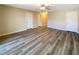 Bright hallway with wood-look floors and access to bedrooms at 9801 Fast Elk St, Las Vegas, NV 89143