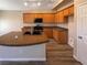 Modern kitchen with wood cabinets, island, and stainless steel appliances at 9801 Fast Elk St, Las Vegas, NV 89143
